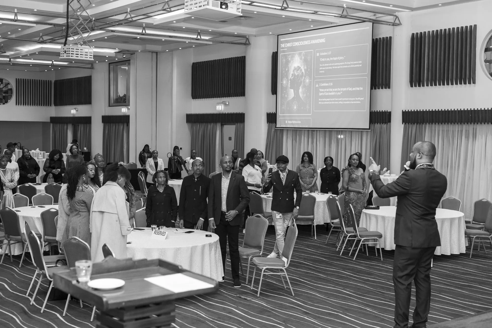 Keith Muoki addressing a full room of delegates at an institutional learning session